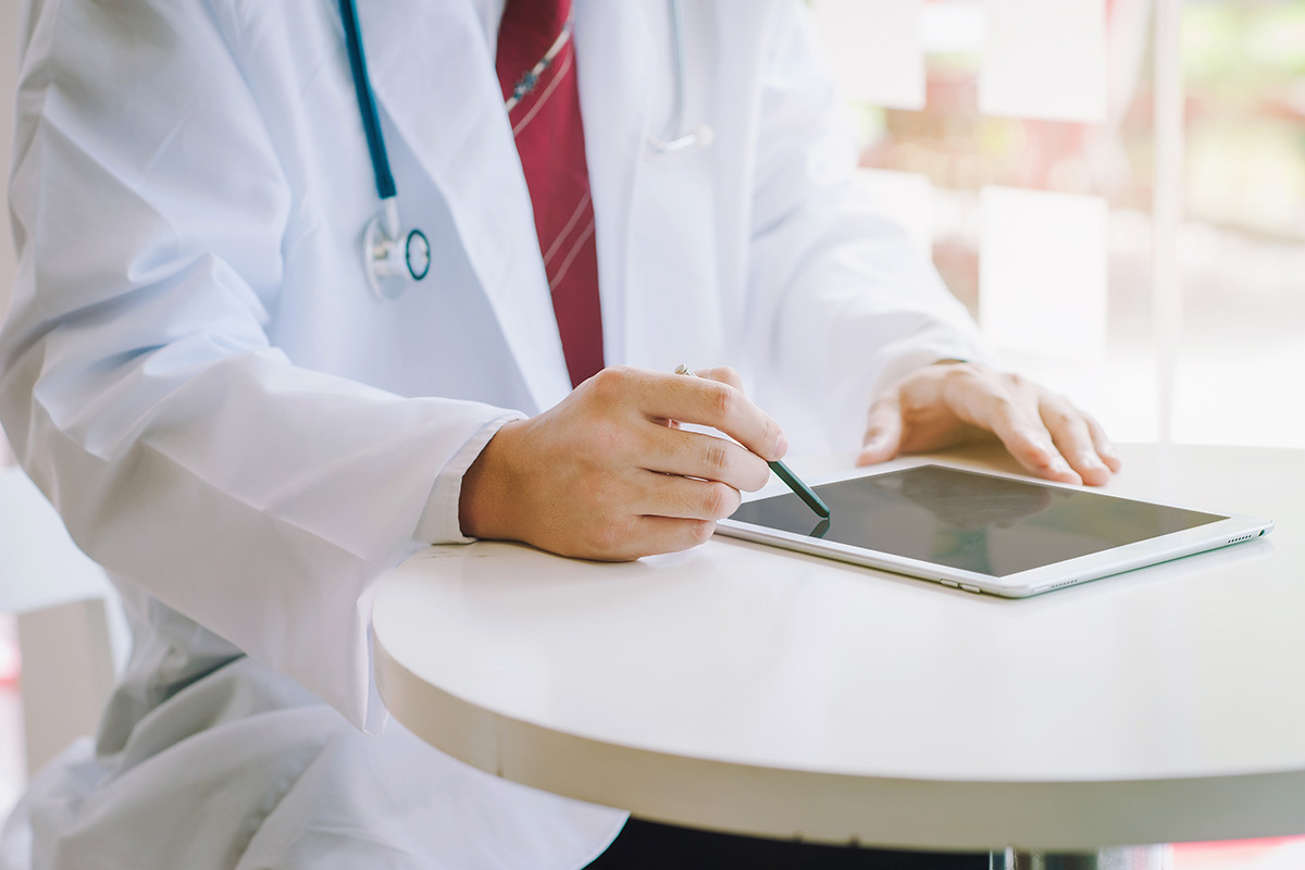 doctor using a tablet