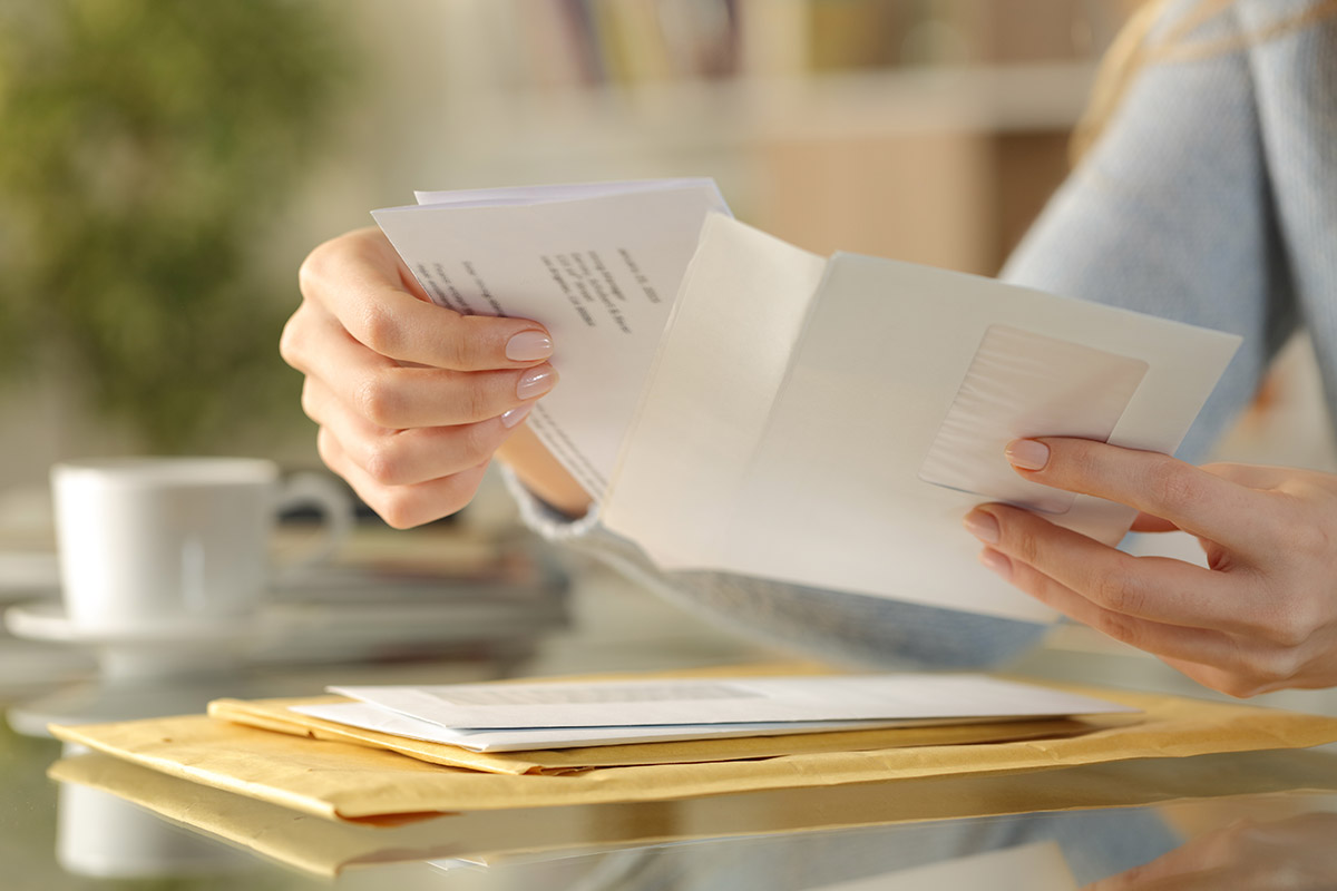 woman opening letters