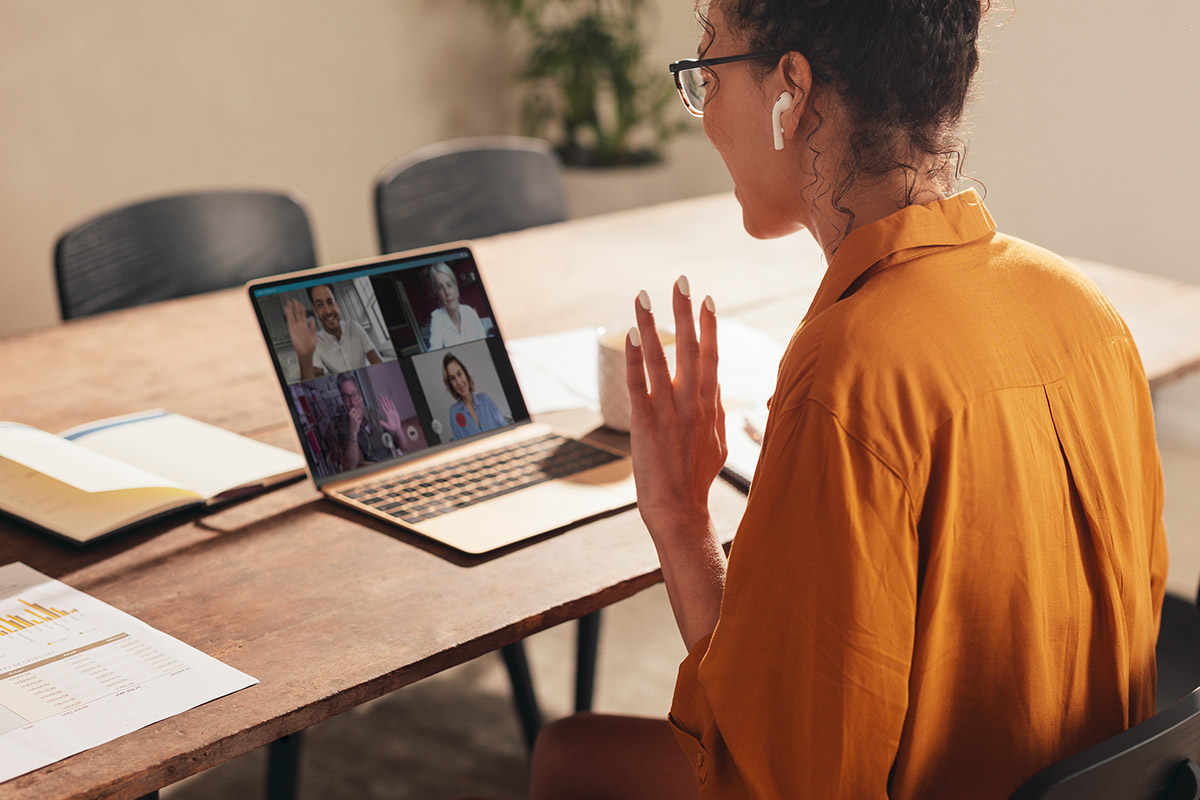 Business woman at home having a zoom call with team