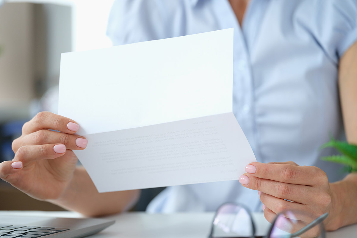 woman opening an envelope