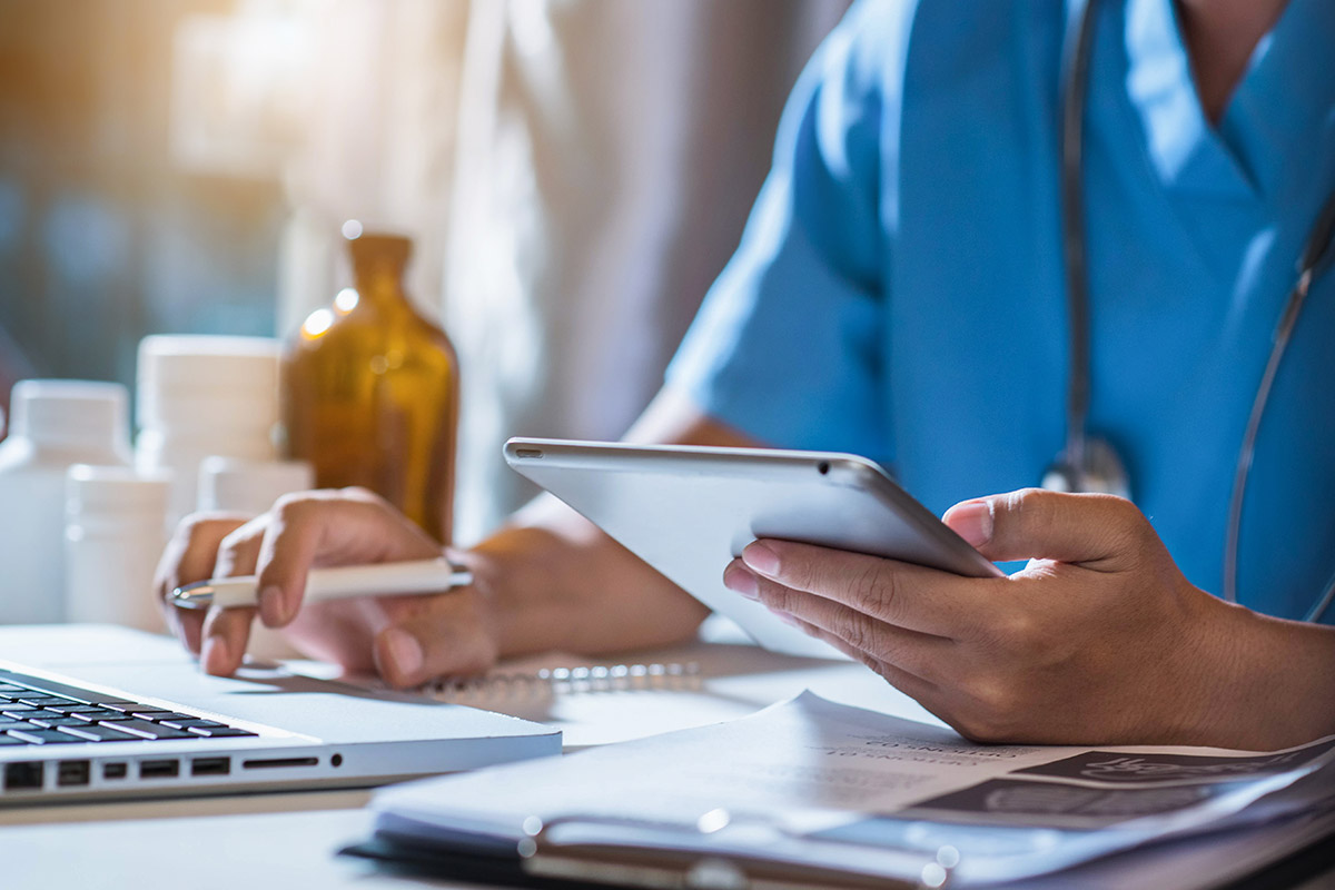 nurse using tablet